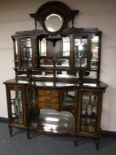 A late Victorian rosewood and satinwood inlaid serpentine front mirror back sideboard, width 168cm.