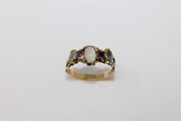 A Georgian gold ring set with moonstone and pink sapphires, size N.
