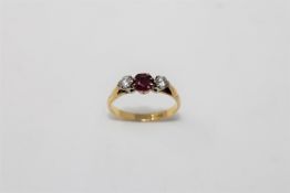 An 18ct gold ruby and two stone diamond ring, size O/P, 3.3g.