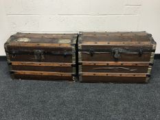 Two early 20th century cane bound dome top trunks.