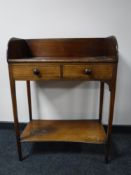 A 19th century mahogany washstand fitted with two drawers, width 67cm.