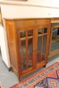 A mahogany double door glazed display cabinet, width 88cm.