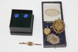 A Victorian gold stick pin, a diamond set gold brooch, two medallions,