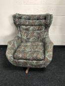 A mid 20th century Parker Knoll relaxer swivel chair, width 86cm.