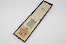 A 9ct gold and enamel Masonic medal, inscribed 'Presented to W. Bro.
