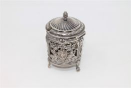 An 18th century French ornate silver mustard pot,
