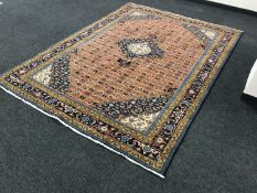 A Persian Tabriz design carpet, 283cm by 205cm.