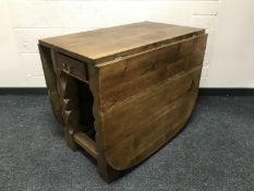 A good quality oak dropleaf dining table, fitted with a drawer, width 89cm.