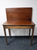 A George III mahogany turnover top tea table, with 84cm.