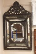A 19th century repousse framed mirror.