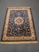 A machine made rug of Nain design, 195cm by 134cm.