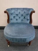 A Victorian mahogany button-back lady's chair, raised on ceramic castors, width 59cm.