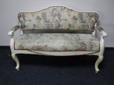 A 19th century painted pine settle, width 150cm.