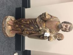 An interesting collection of sixteen polychrome wooden religious figures, probably European,