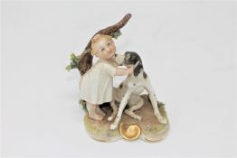 A Capodimonte porcelain figure of a baby and dog, height 9cm.