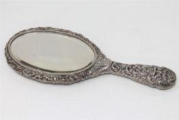 A Victorian silver hand mirror.