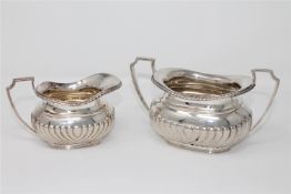 A silver sugar bowl and matching cream jug, Henry Wigfull, Sheffield 1908, the sugar bowl 8cm high,