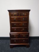 A reproduction mahogany multi-drawer chest, width 41cm.