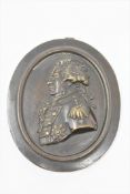 A 19th century bronze plaque depicting an admiral, height 11cm.