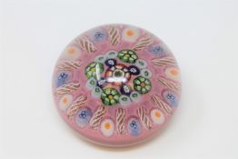 A 20th century Scottish millefiori glass paperweight by Paul Ysart, diameter 7cm.