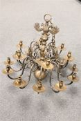 A continental brass eighteen-branch chandelier, width 74cm.