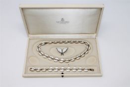 A Norwegian part suite of silver-gilt and enamel jewellery by David Andersen,