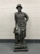 An impressive bronze statue - The Blacksmith, with hammer, height 193cm.
