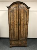 An eighteenth century walnut domed topped cabinet, width 83 cm.