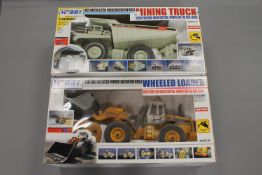 Two Hobby Engine Mining trucks, radio controlled, both boxed.