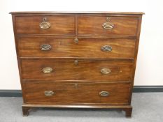 A George III mahogany chest of two short over three long drawers, on bracket feet, width 126cm.