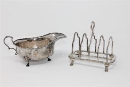 A silver toast rack, Sheffield 1926, together with a silver sauce boat, 255.6g.
