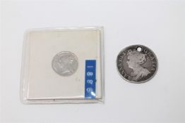 A Queen Anne Shilling 1711, pierced at 12 o' clock. Together with a Victorian three pence 1886.
