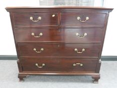 A George III mahogany chest of five drawers, raised on ogee bracket feet, width 120cm.