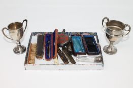 Two silver miniature trophies, together with white metal scent flask, fruit knives, amber cheroot,