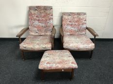A pair of mid 20th century teak armchairs, with matching footstool.