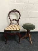 A small circular piano stool together with a Victorian style chair.