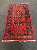 A Persian Hamadan rug, 195cm by 110cm.