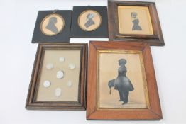 A group of four early/mid 19th century silhouette portraits together with a glazed display case of