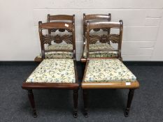 A set of four 19th century mahogany dining chairs upholstered in floral fabric.