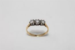 An 18ct gold three stone diamond ring, approximately 0.5ct, size O/P, 2.7g.