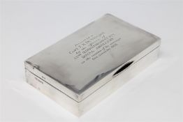 A silver cigarette case of military interest, inscribed 'Presented to Capt. F. X.