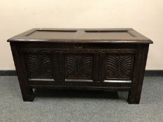 A George III panelled oak coffer,