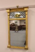 An early 19th century giltwood pier glass, height 59cm.