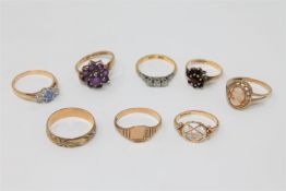 An 18ct gold three stone diamond ring, together with seven various 9ct gold rings.