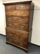A George III oak chest on chest, fitted with eight drawers, on bracket feet, width 113 cm.