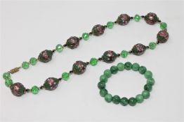 A Venetian glass wedding cake necklace, together with a jadeite bracelet.