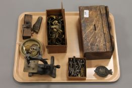 A 19th century miniature sewing machine, together with antique door keys, brass door furniture,