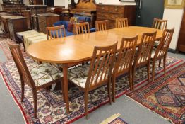 A mid 20th century Swedish teak extending dining table by Troeds Bjarnum, with two leaves,