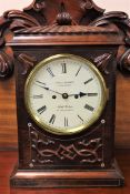 A mid-19th century rosewood and mother of pearl inlaid striking bracket clock,