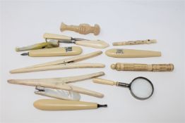 A Victorian mother of pearl seal, together with Victorian ivory stanhope, glove stretchers etc.